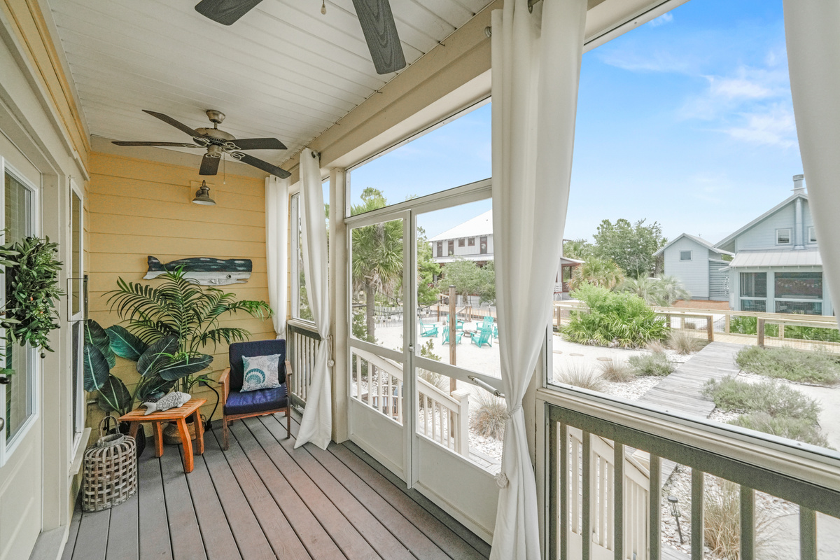 Enjoy morning coffee or evening cocktails from the comfort of the screened-in porch overlooking the neighborhood