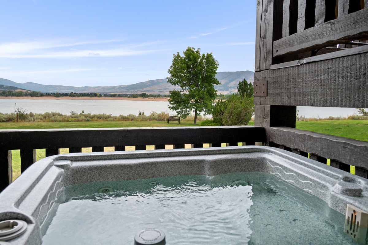 Private hot tub, BBQ grill, and outdoor seating for year-round relaxation.