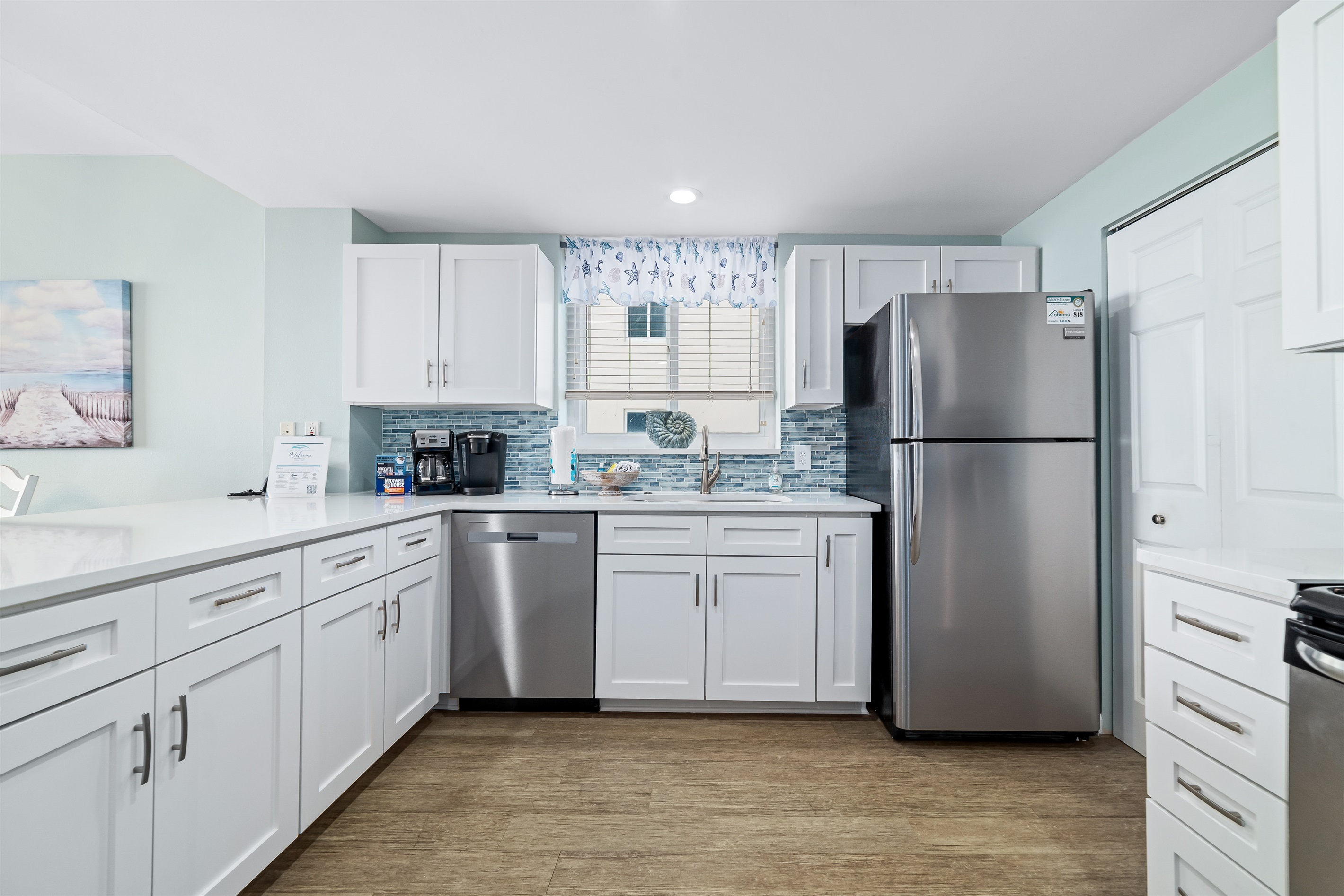 Discover the convenience of this fully-equipped kitchen, boasting sleek stainless steel appliances, generous granite countertops, and abundant storage. From casual breakfasts to gourmet dinners, you'll find everything you need to enjoy your favorite dishes