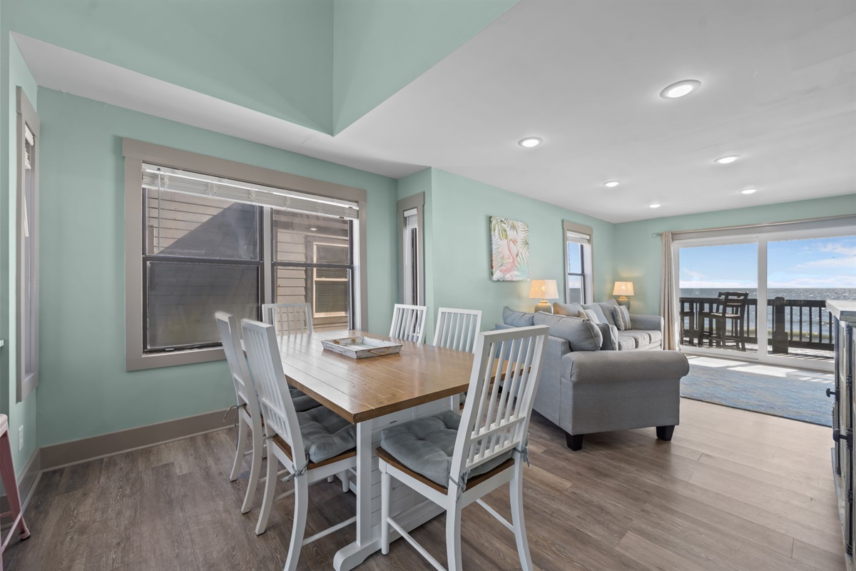 Inviting dining space with seating for the whole group, set within the open-concept layout and just steps from the living area and oceanfront balcony