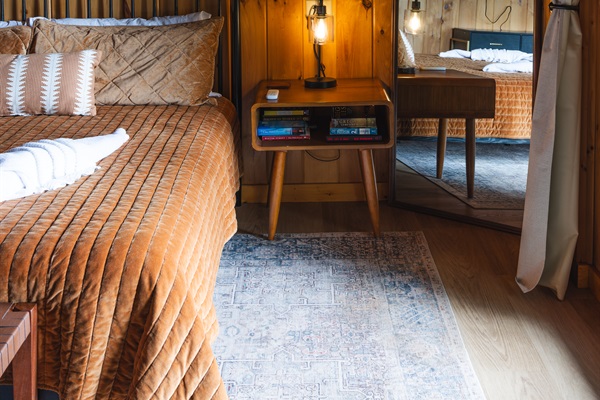 The Lower-Level King Bedroom is thoughtfully stocked with reading books and easy-access USB charging outlets, making it easy to unwind with a good story while keeping your devices powered and within reach.