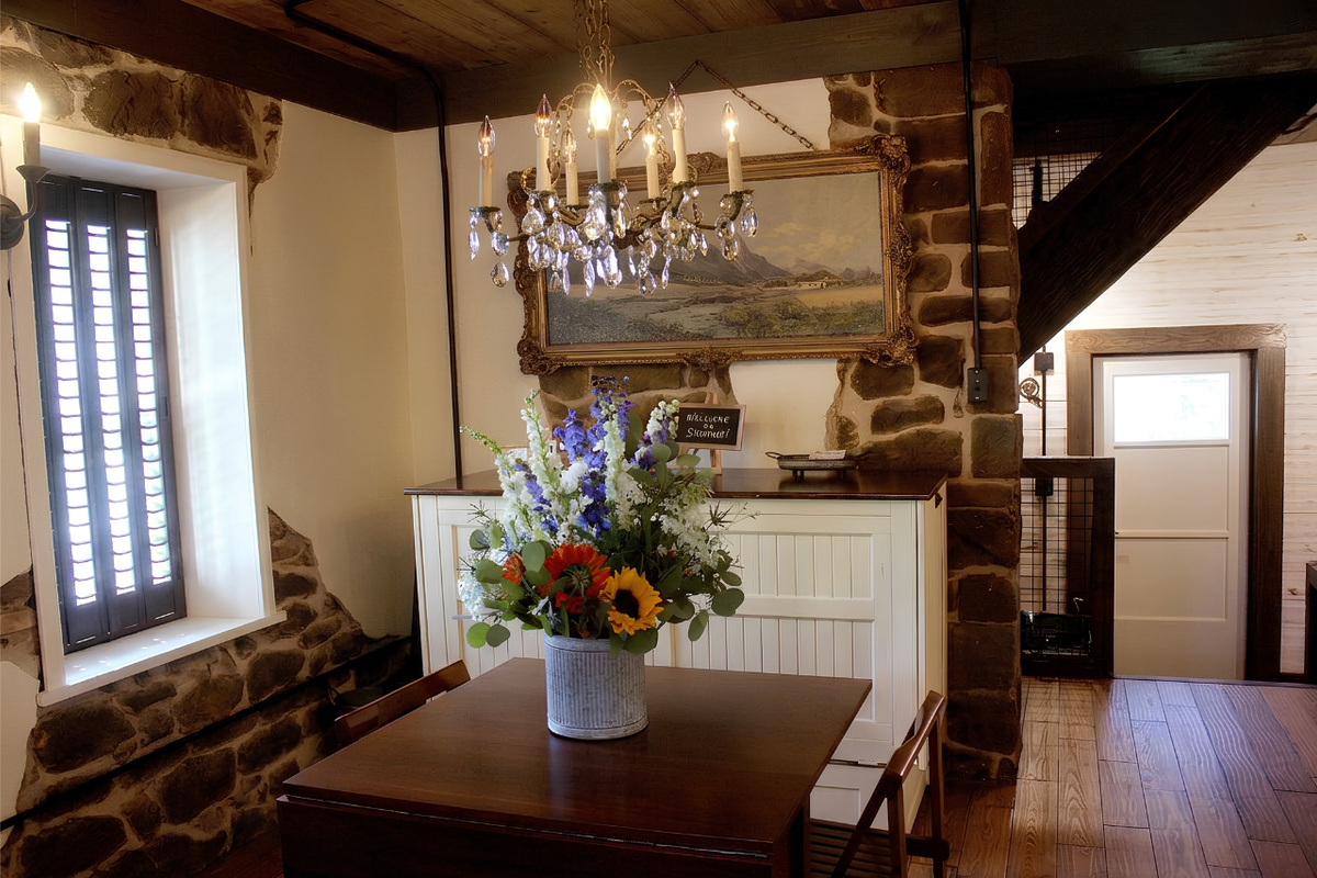 Table surface expands when leaves are ranges - seating for four, original historic plaster remains on the sandstone walls