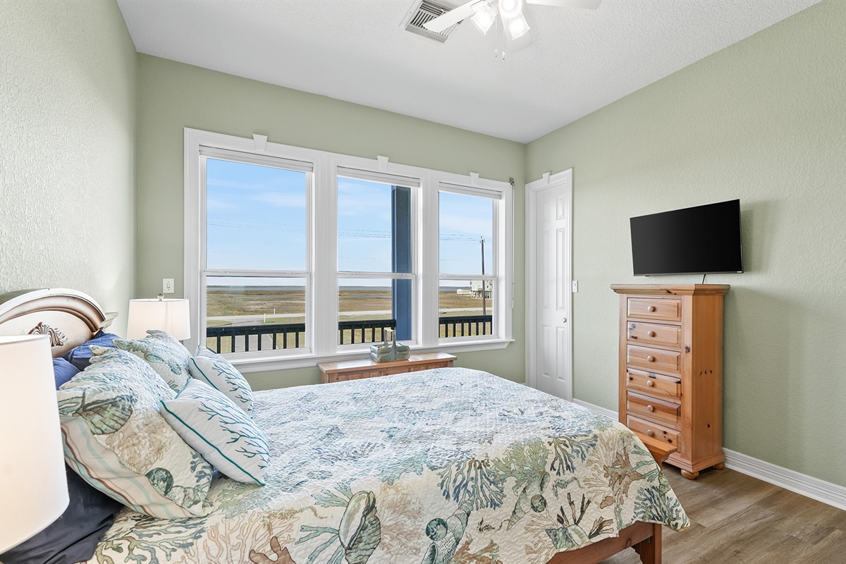 Wake up to sparkling ocean views in this beautifully appointed guest bedroom - the perfect way to start each vacation day.