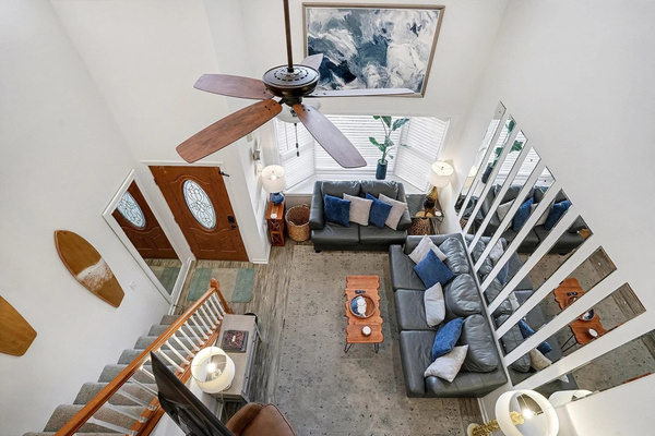 The two-story great room from above — plenty of seating for movie night