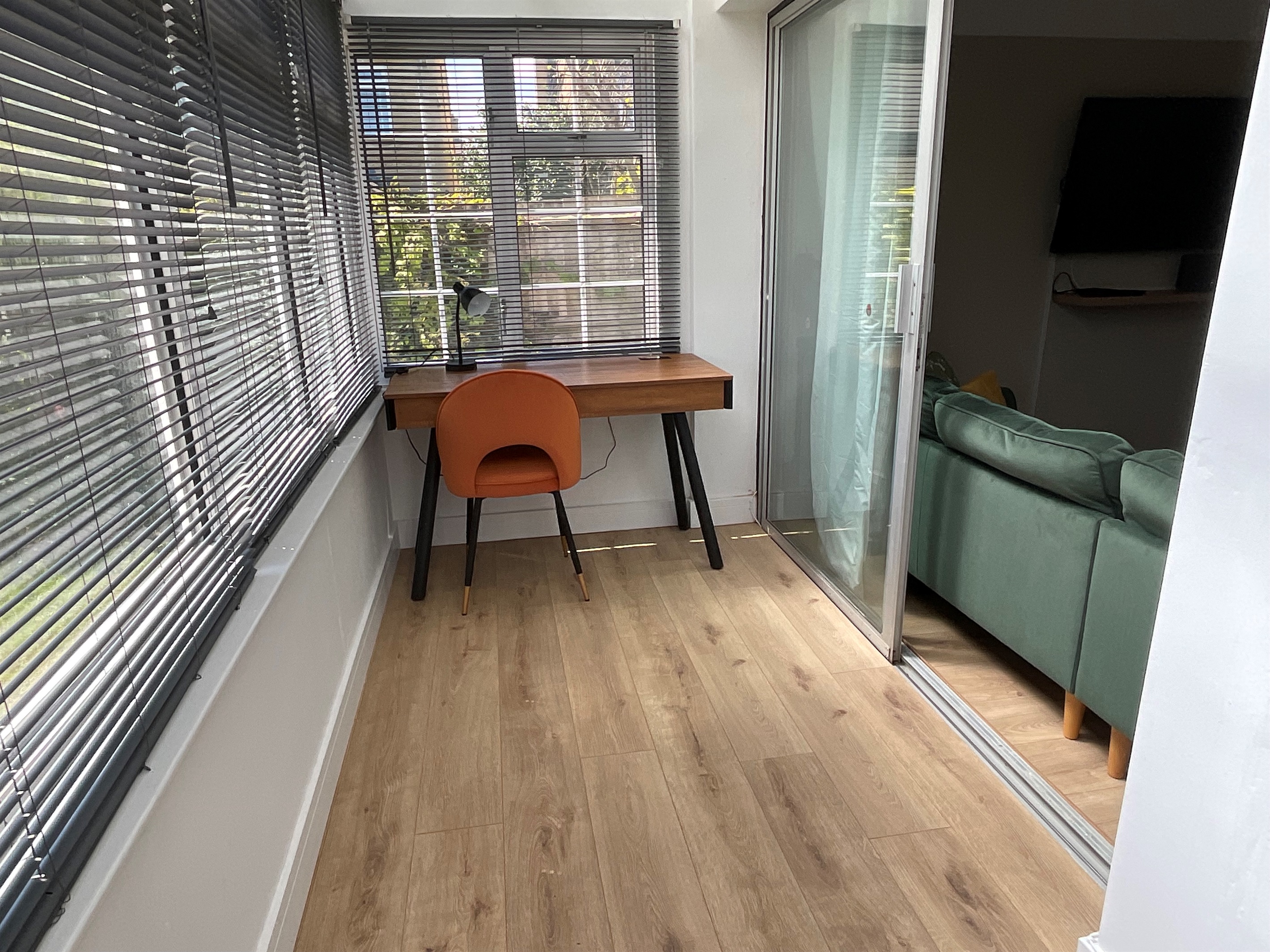 The porch area has a smart desk that with Bluetooth speakers to cast music to.  Alternatively, there is room here to store bicycles.