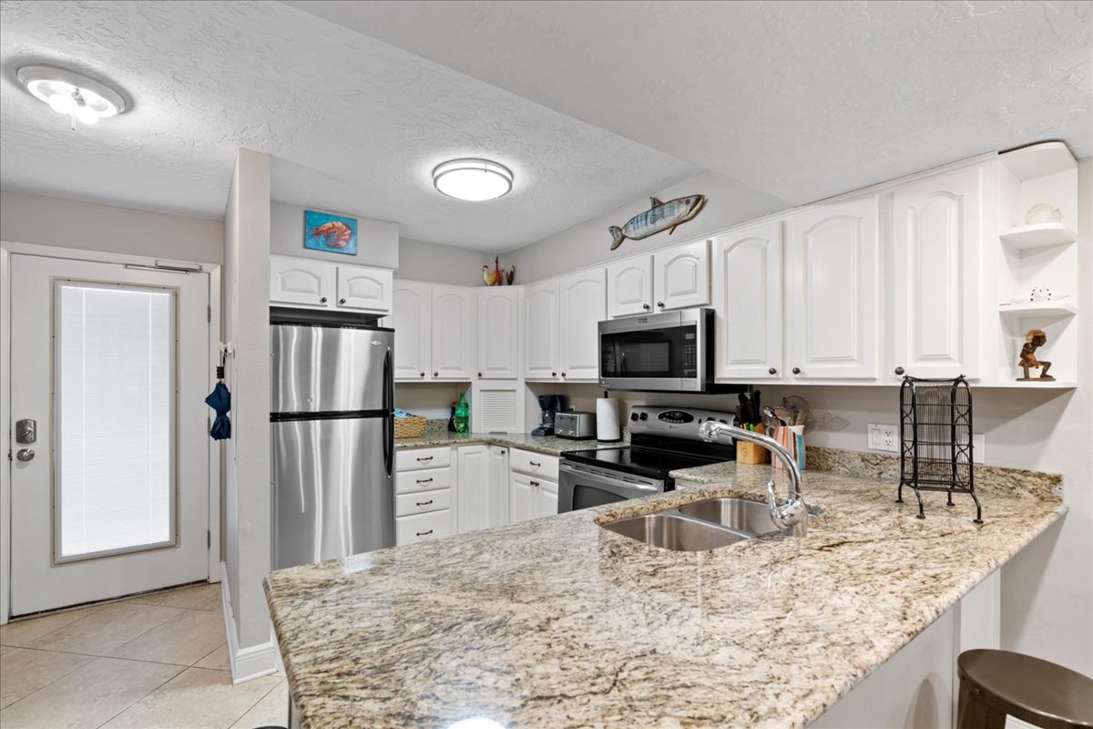 Cook delicious meals in the REMODELED Kitchen while overlooking the Gulf of Mexico