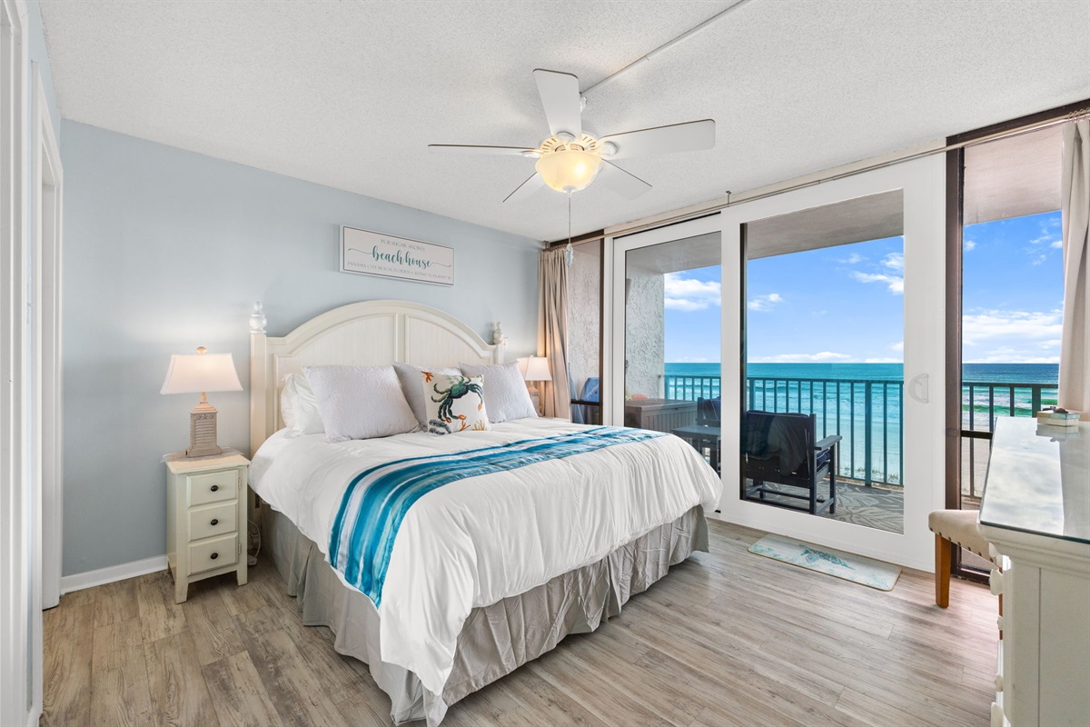 King bed with patio access from Primary Bedroom.  Perfect for coffee in the morning.