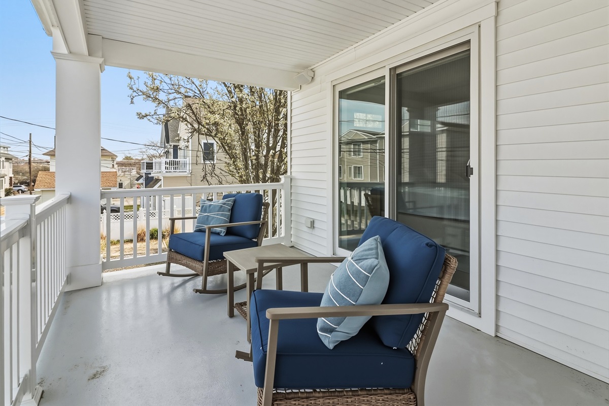 Spacious balcony area with outdoor furniture