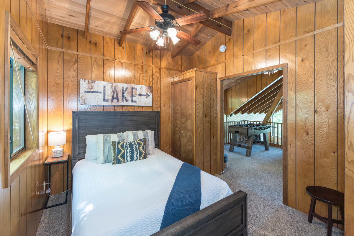 Upstairs queen bedroom with sliding pocket door.
