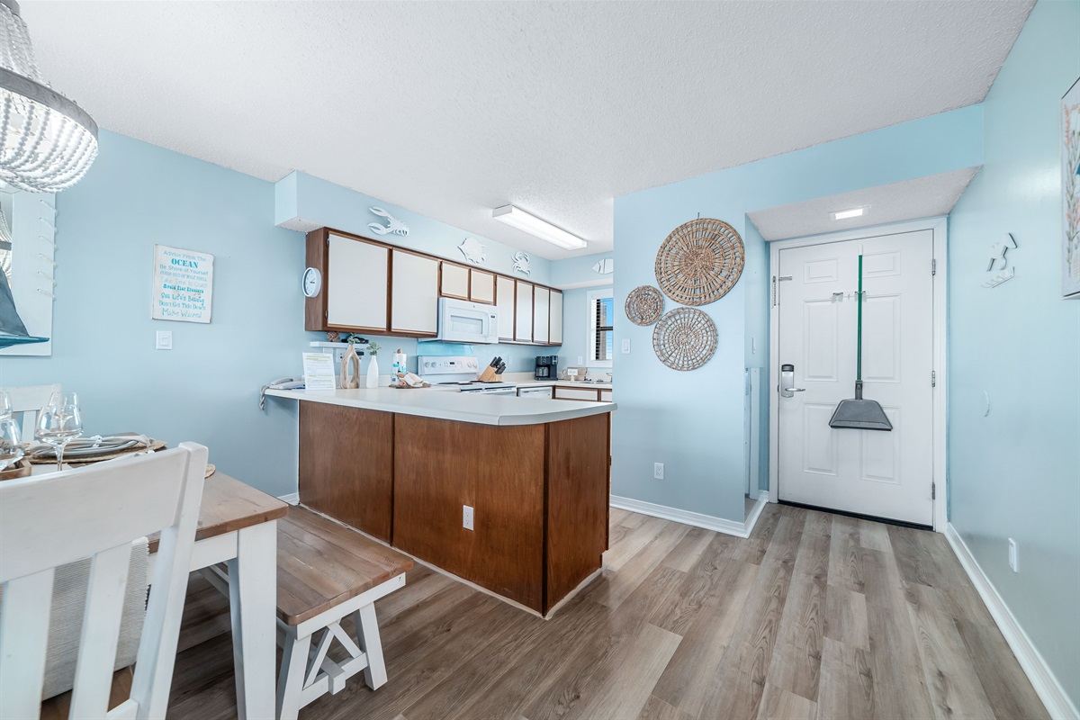 A well-equipped kitchen featuring modern appliances and stylish finishes, perfect for culinary enthusiasts.