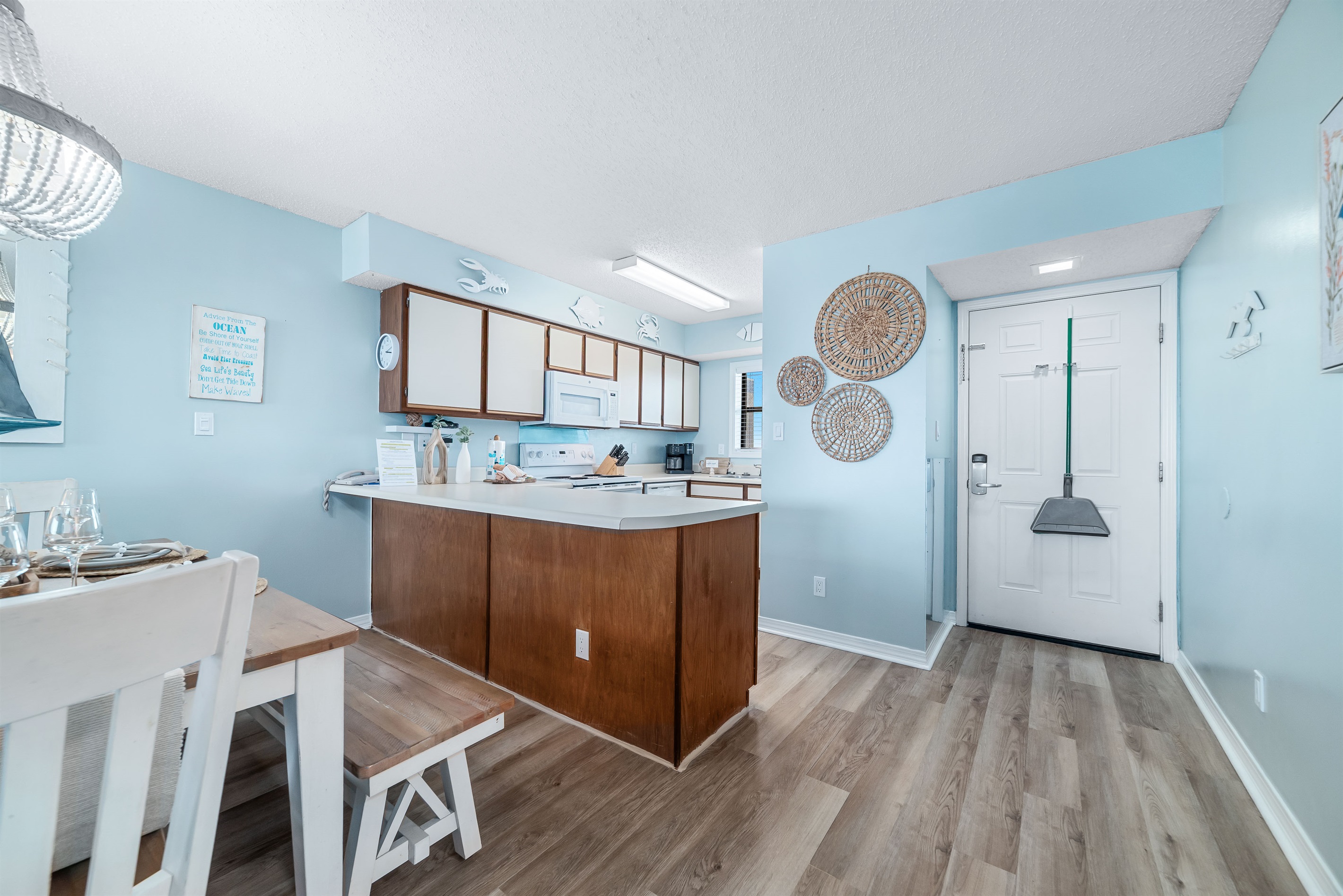 A well-equipped kitchen featuring modern appliances and stylish finishes, perfect for culinary enthusiasts.