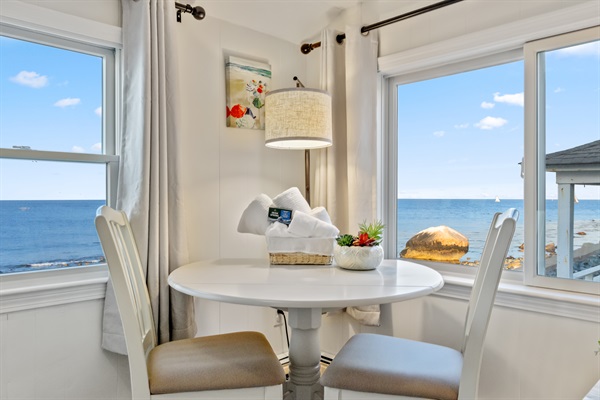 This second-floor bedroom includes a charming sitting area and table!