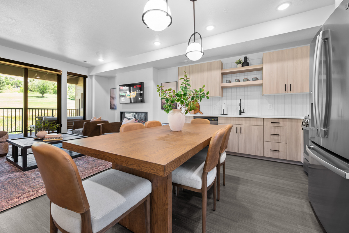 Open dining area with easy access to the kitchen and balcony.