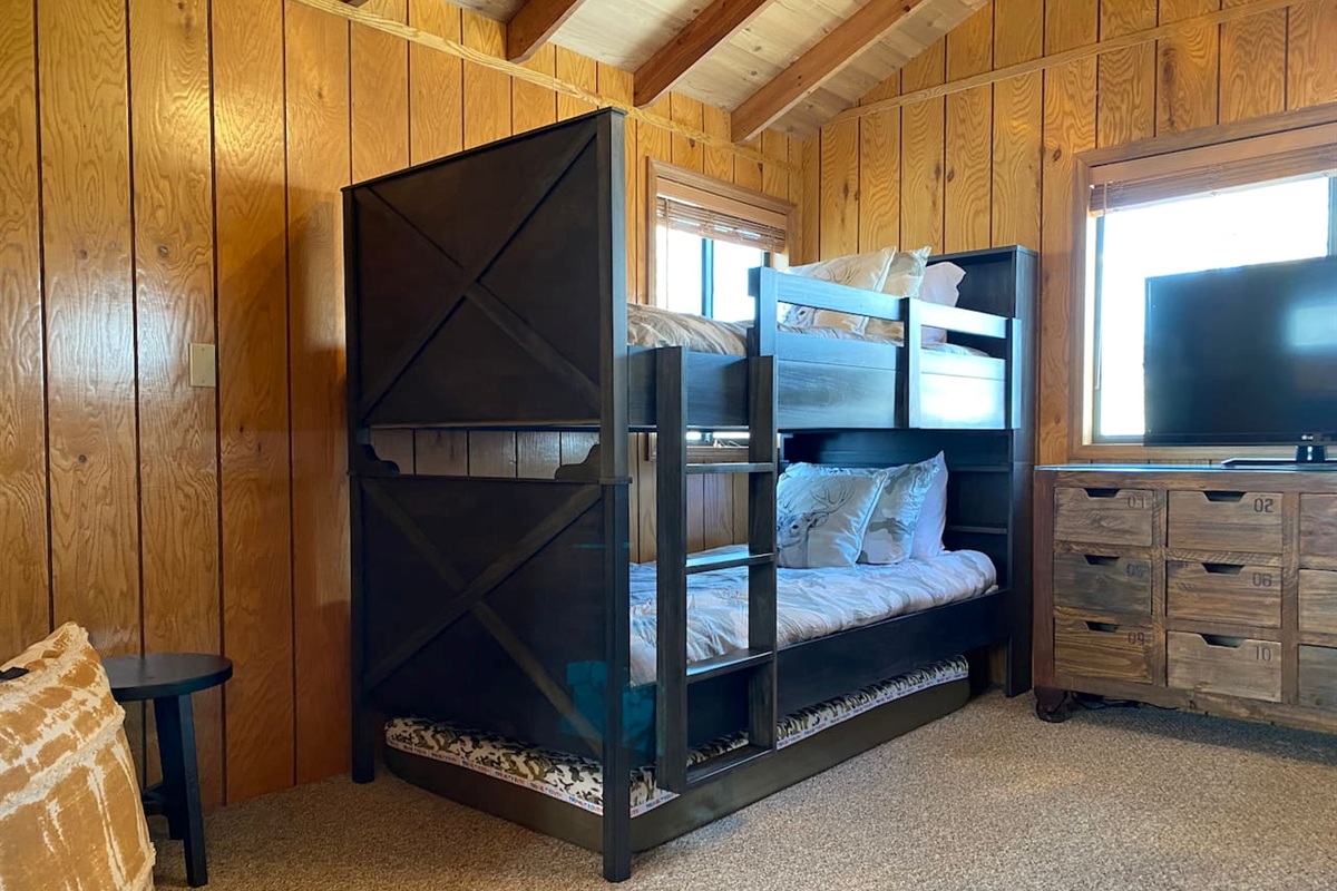 Two bunk beds with an extra 3rd mattress underneath that can be pulled out for kids