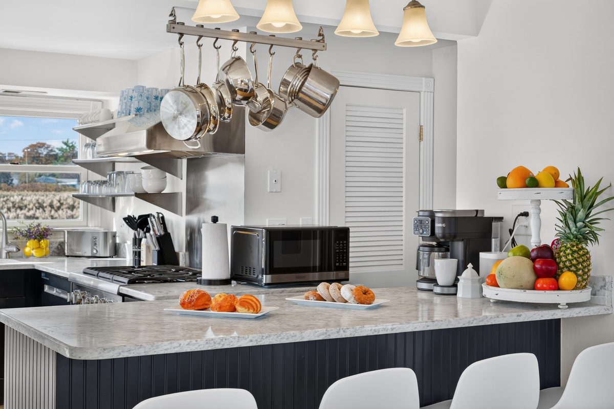 Spacious kitchen island provides plenty of room for preparing meals and gathering together.