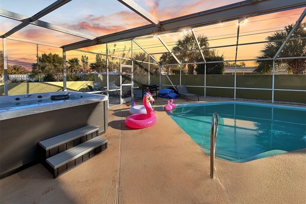 Screened-in pool oasis with relaxing spa to help soak up the Florida sun.