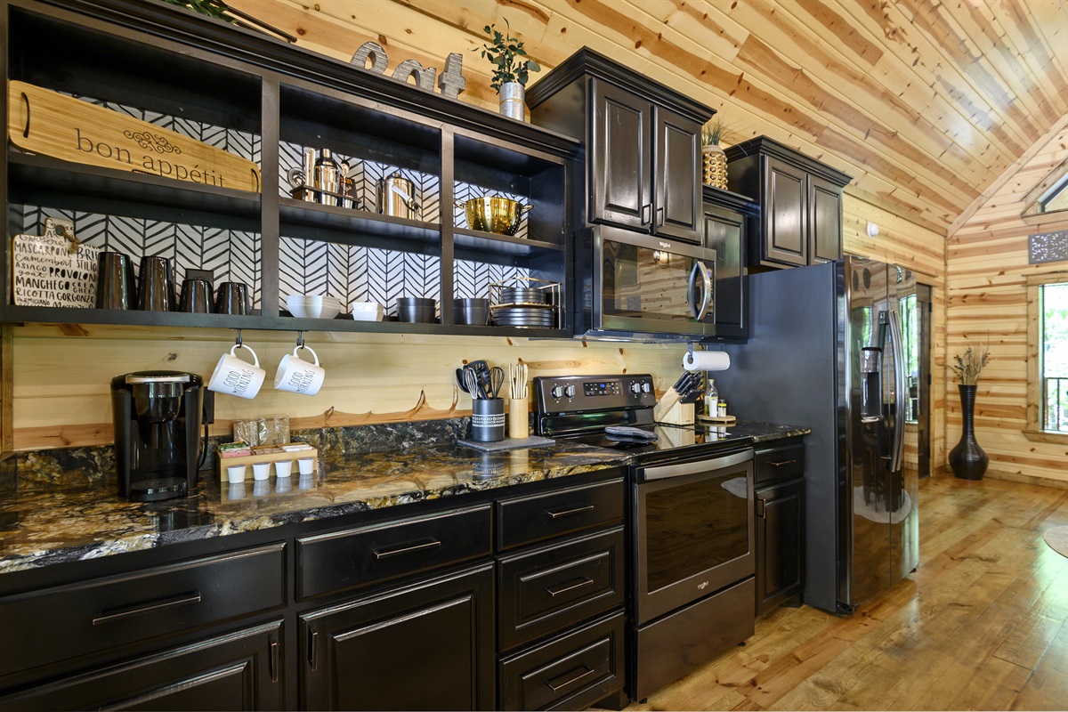 Fully equipped kitchen, stocked with everything you would need to prepare a meal.