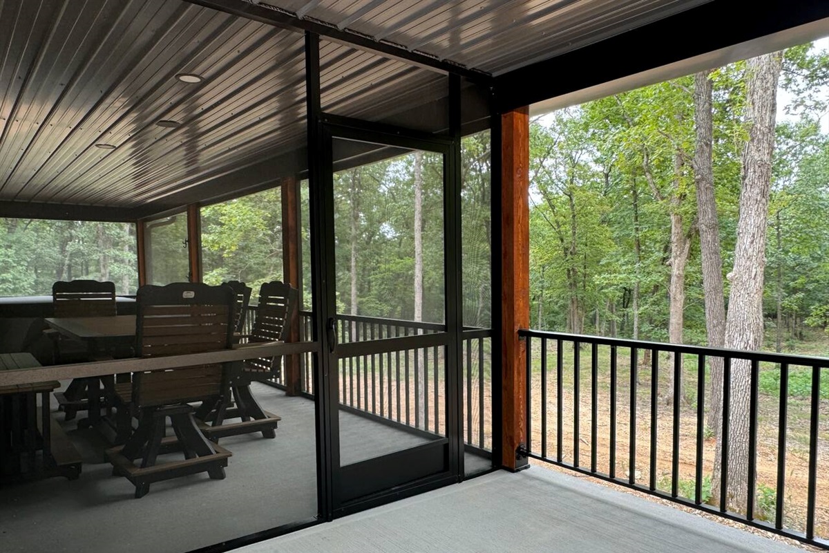 Entry to screened in Area from the covered outside Concrete porch.