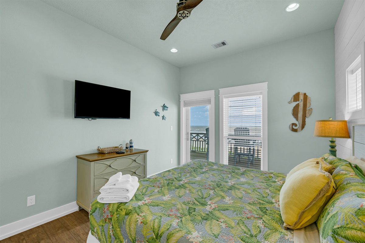 Sea It All: Second level king suite, with private door access to the upper deck and ensuite w/ closet and smart tv.