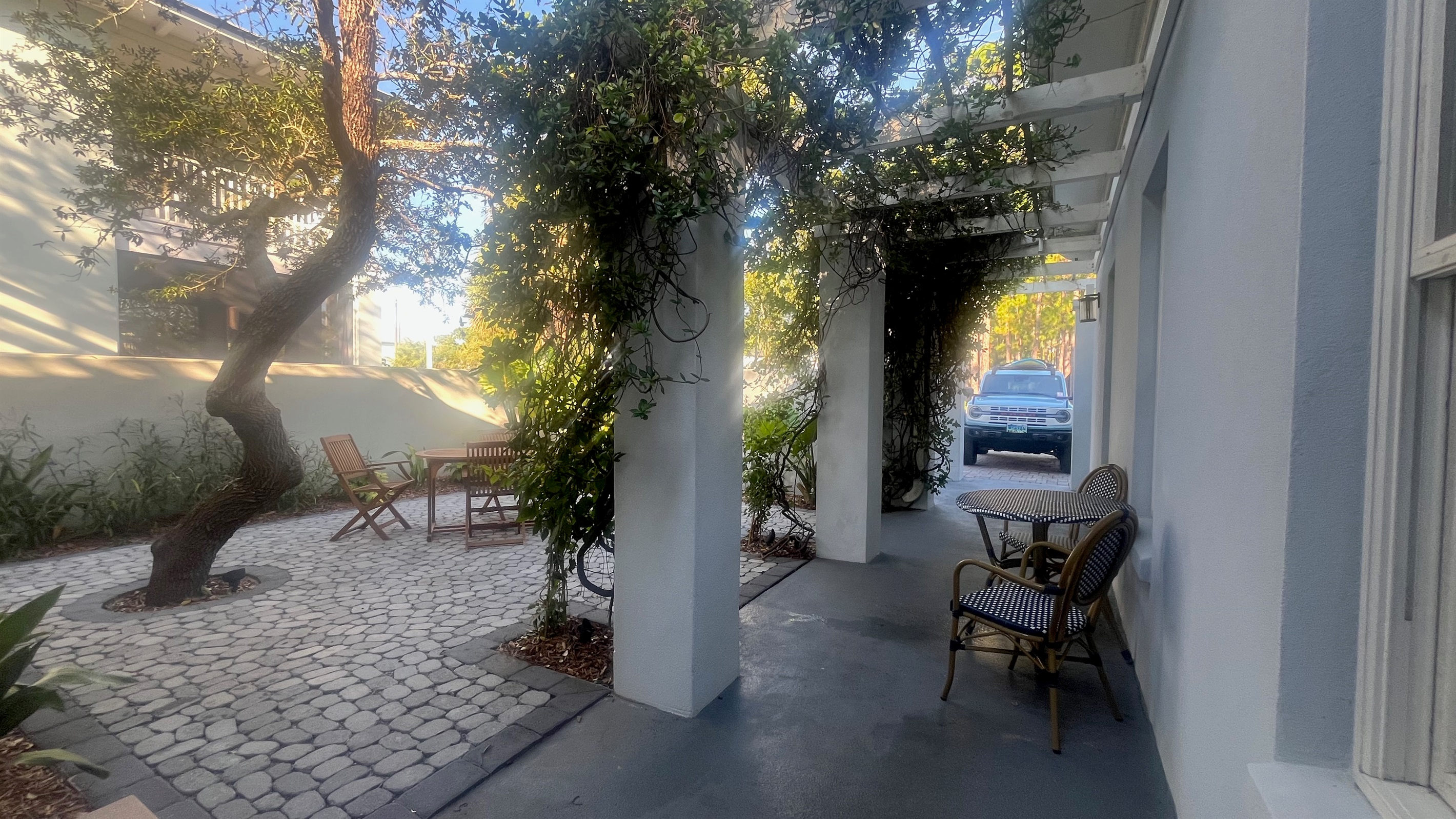 Sheltered, romantic courtyard welcomes visitors to slow down & enjoy their vacation.