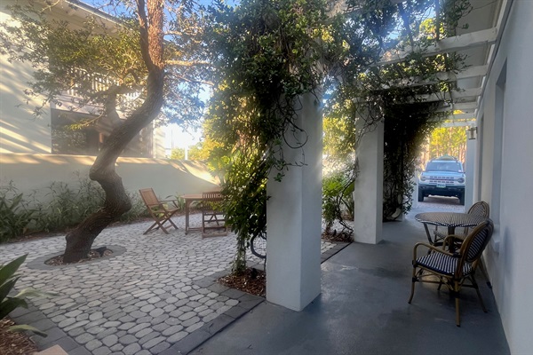 Sheltered, romantic courtyard welcomes visitors to slow down & enjoy their vacation.