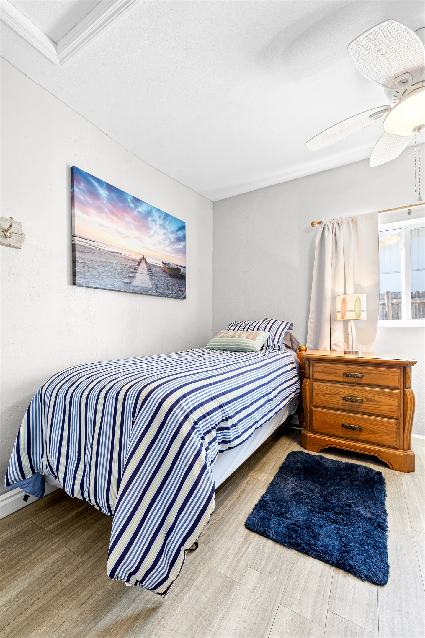 Dolphin Pod Twin room with Linens.  Nightstand, dresser and closet!