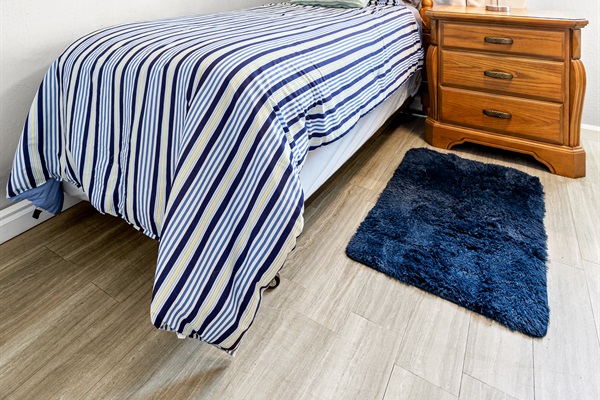 Dolphin Pod Twin room with Linens.  Nightstand, dresser and closet!