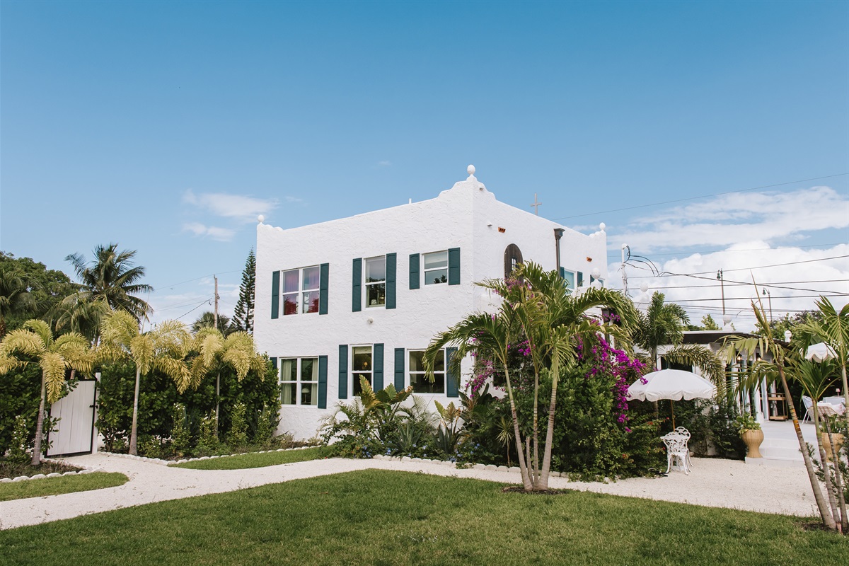 A view of the main home from across the lawn, illustrating how spacious and peaceful our grounds are.