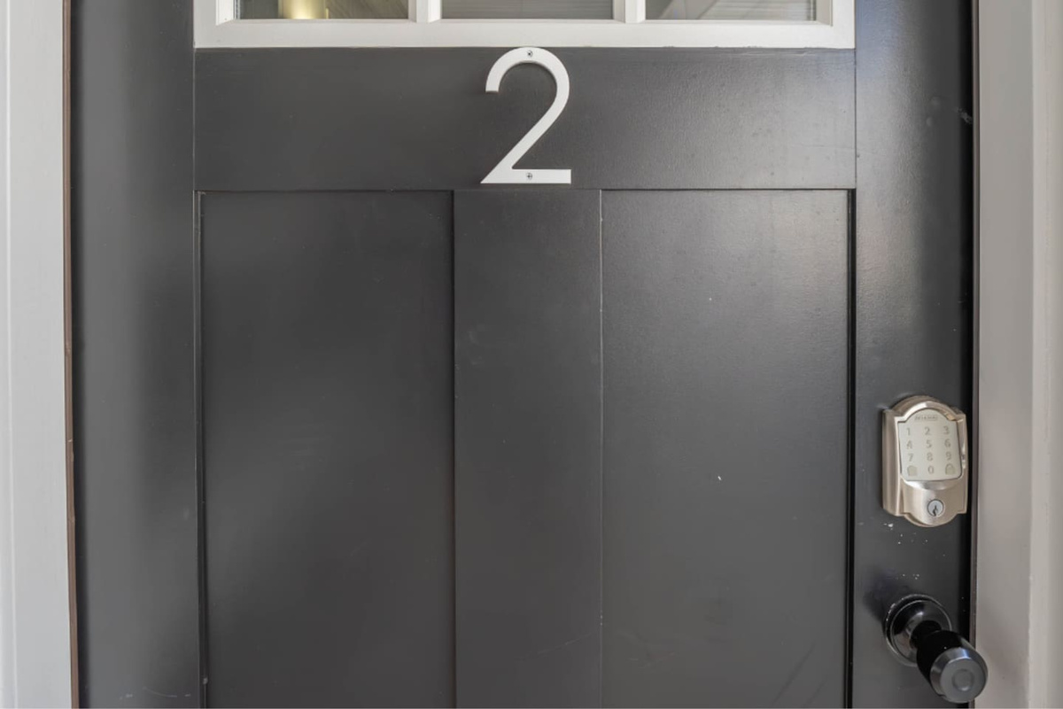 Private unit entrance with secure keypad lock and clear unit number. Provides easy self check-in and added peace of mind, allowing guests to arrive and access the space smoothly at any time.