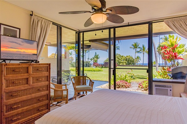 Master bedroom with private lanai and smart television.