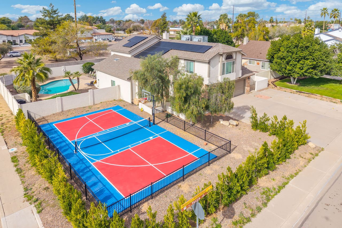 Multi-sport courts with pool access—pickleball, basketball, and tennis all in one property.