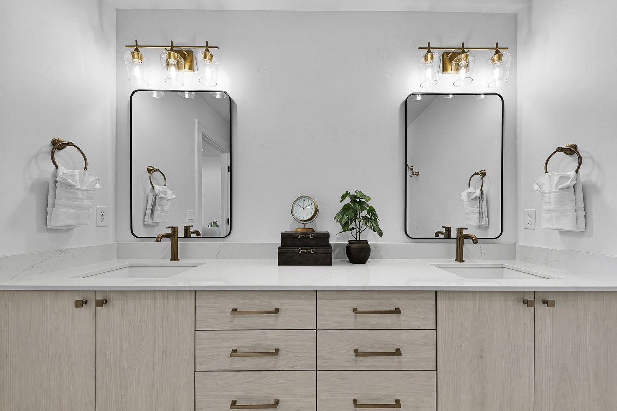 3rd floor bedroom with king size bed ensuite bathroom with shower and dual sink vanity