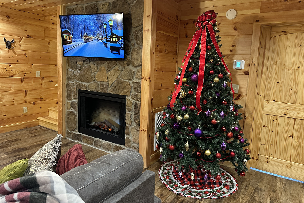 We decorate for Christmas: the tree and fireplace glow all season long during the holiday stays.