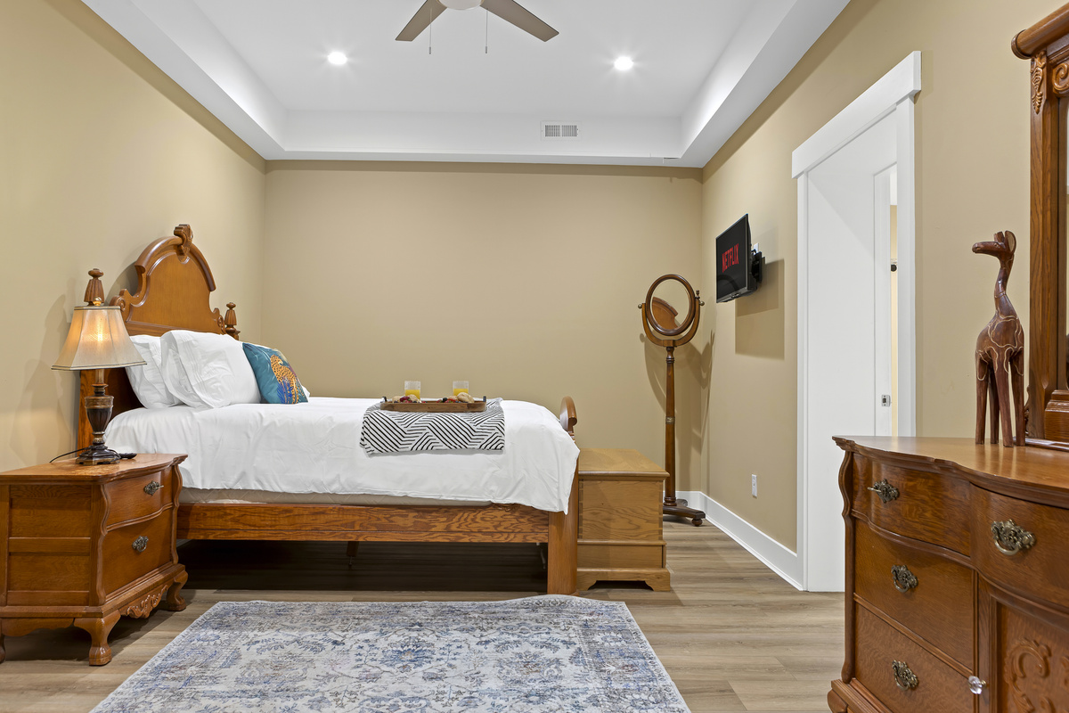 Master Bedroom: Unwind in elegant charm with a plush bed, vintage decor, and Netflix ready!
