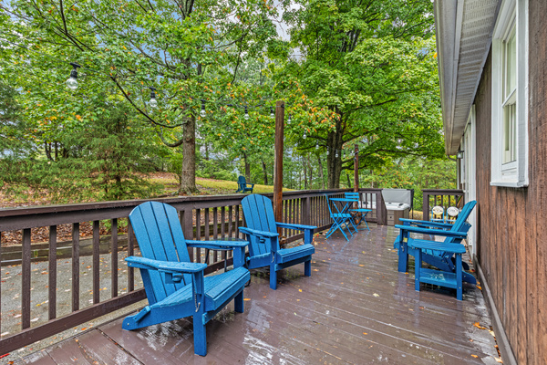 Pull up an Adirondack chair on the deck and soak in the sounds of the surrounding trees — with string lights overhead and a grill on hand for firing up dinner, it's the perfect spot to unwind, relax, and enjoy the outdoors.