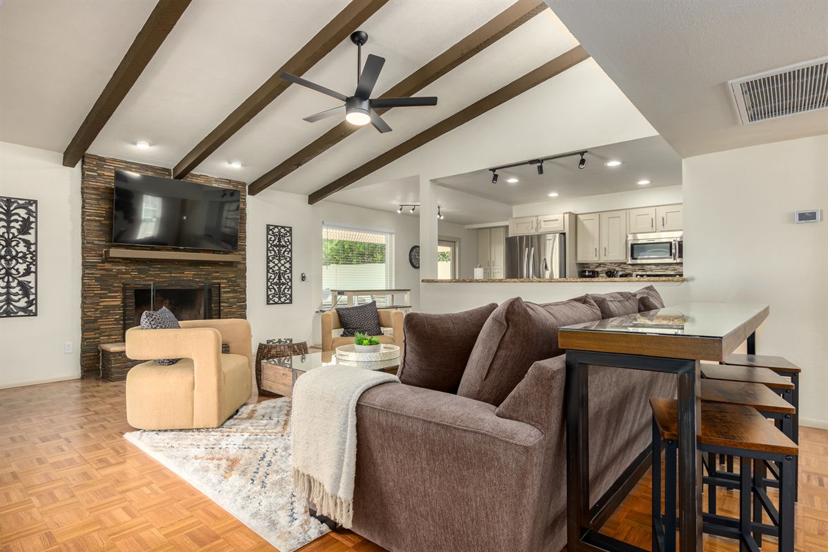 open floor plan- kitchen & cozy living room w/ ample seating + Smart TV