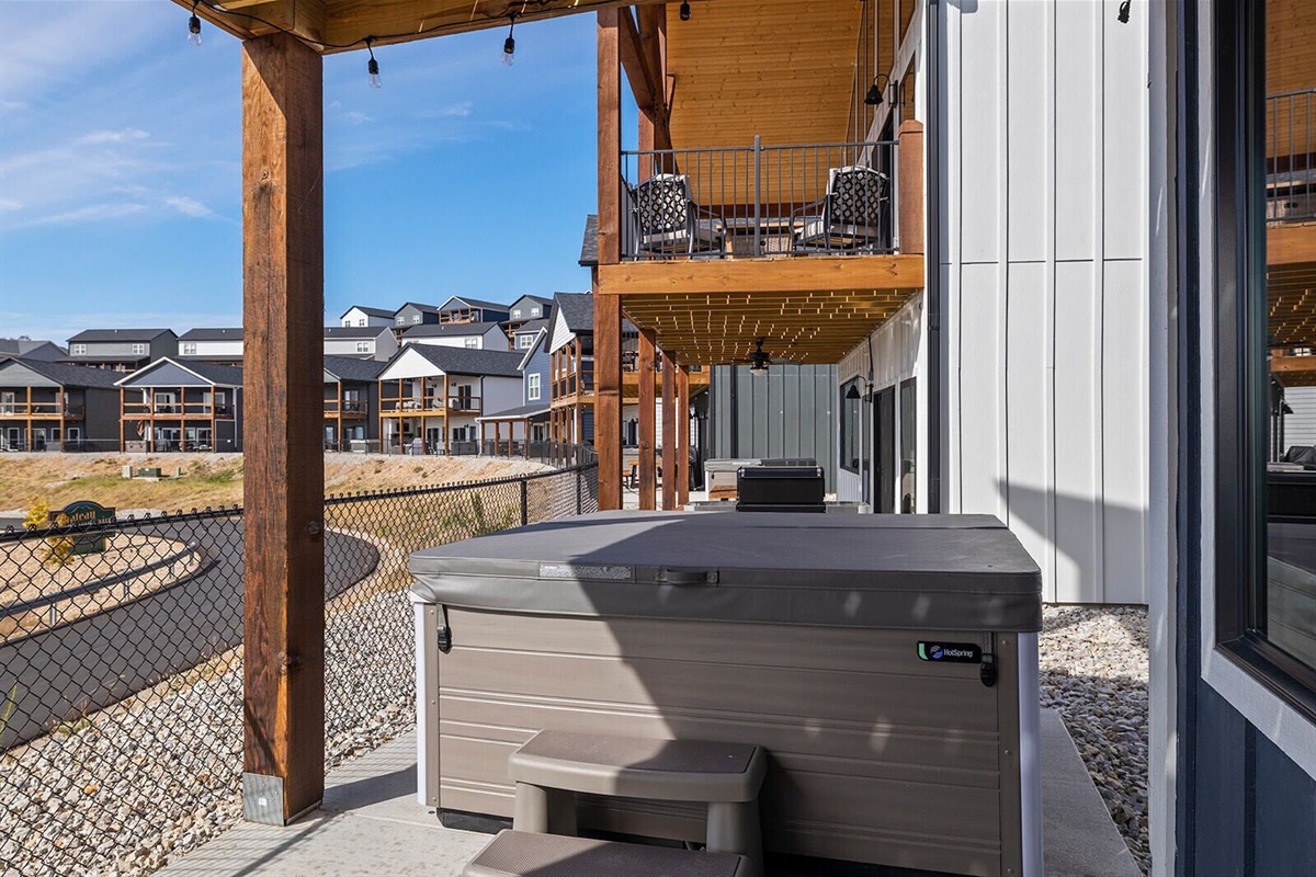 7 person hot tub.  Fence has been installed for privacy (not shown in this pic)