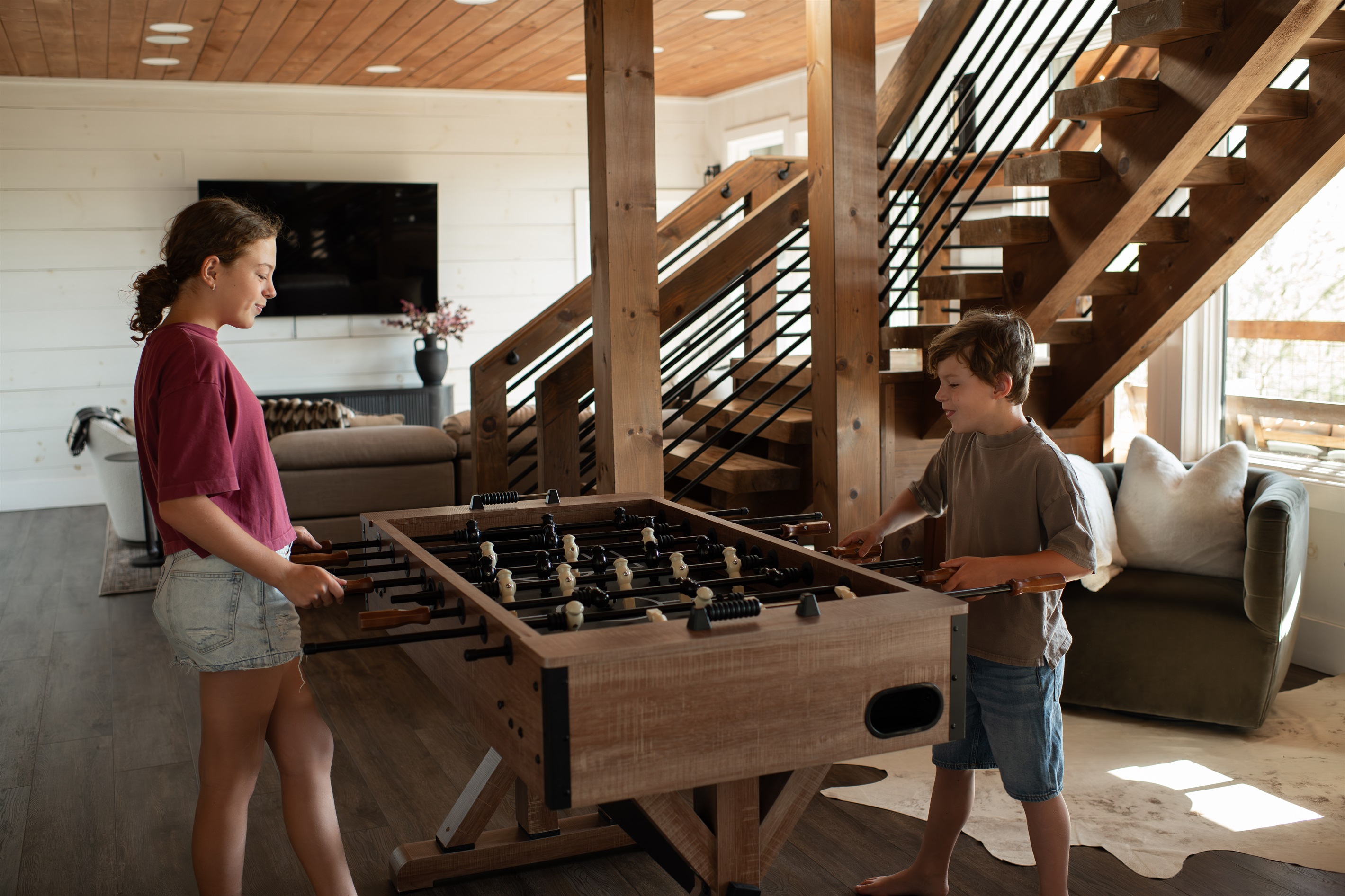 Game Lounge | Elevated entertainment space with foosball and cozy reading nook