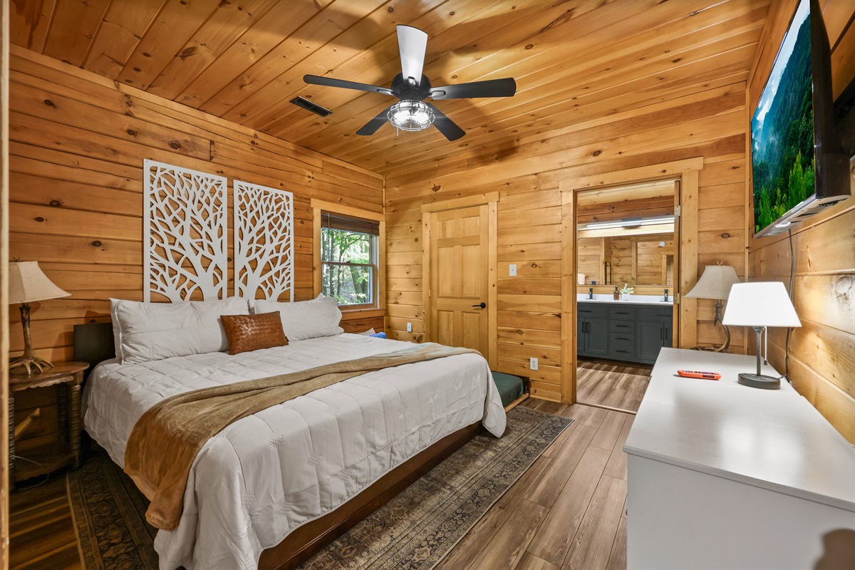 Primary ensuite bedroom with king bed and twin trundle