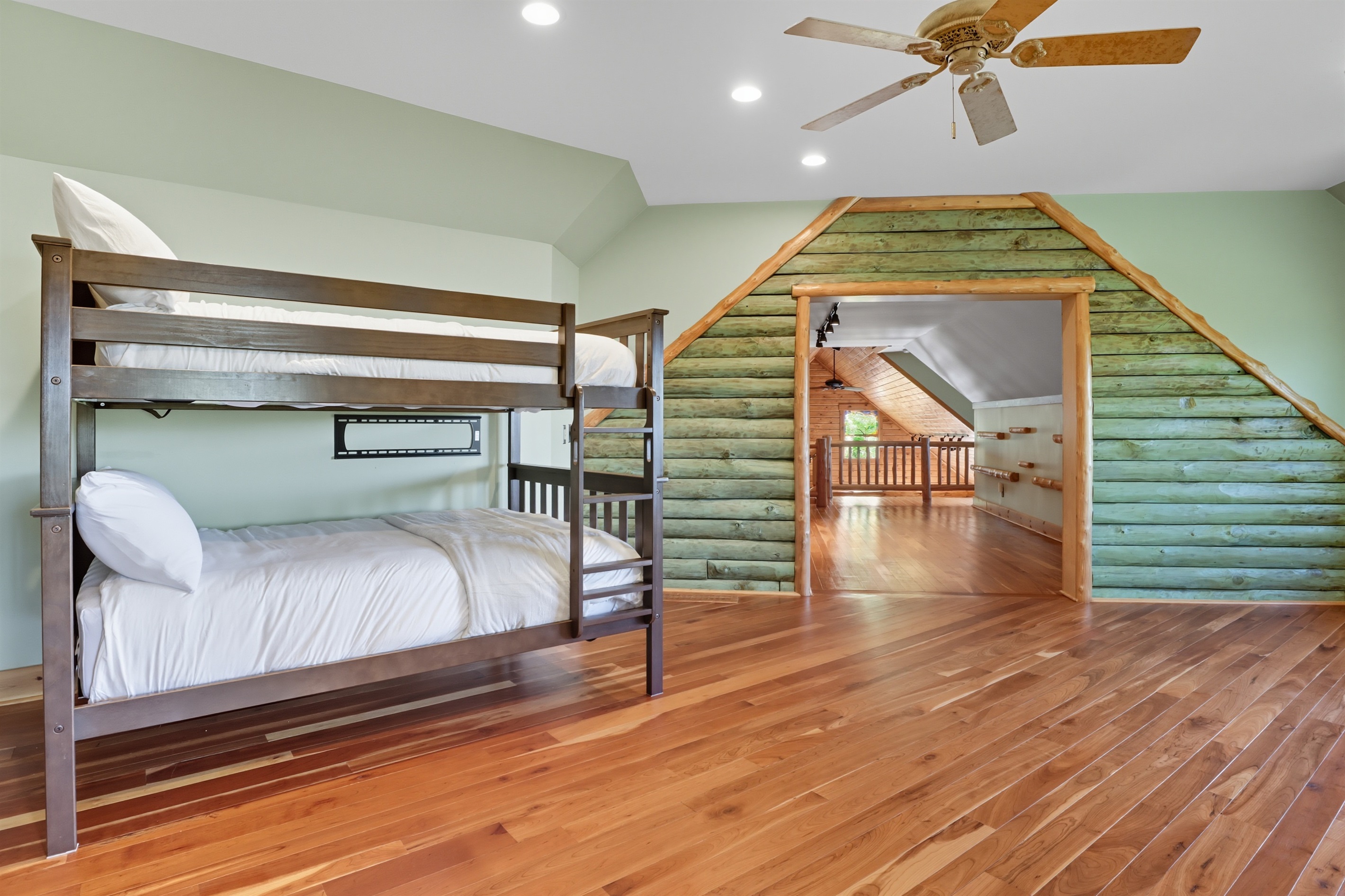 Cozy bunk room with additional sleeping options.