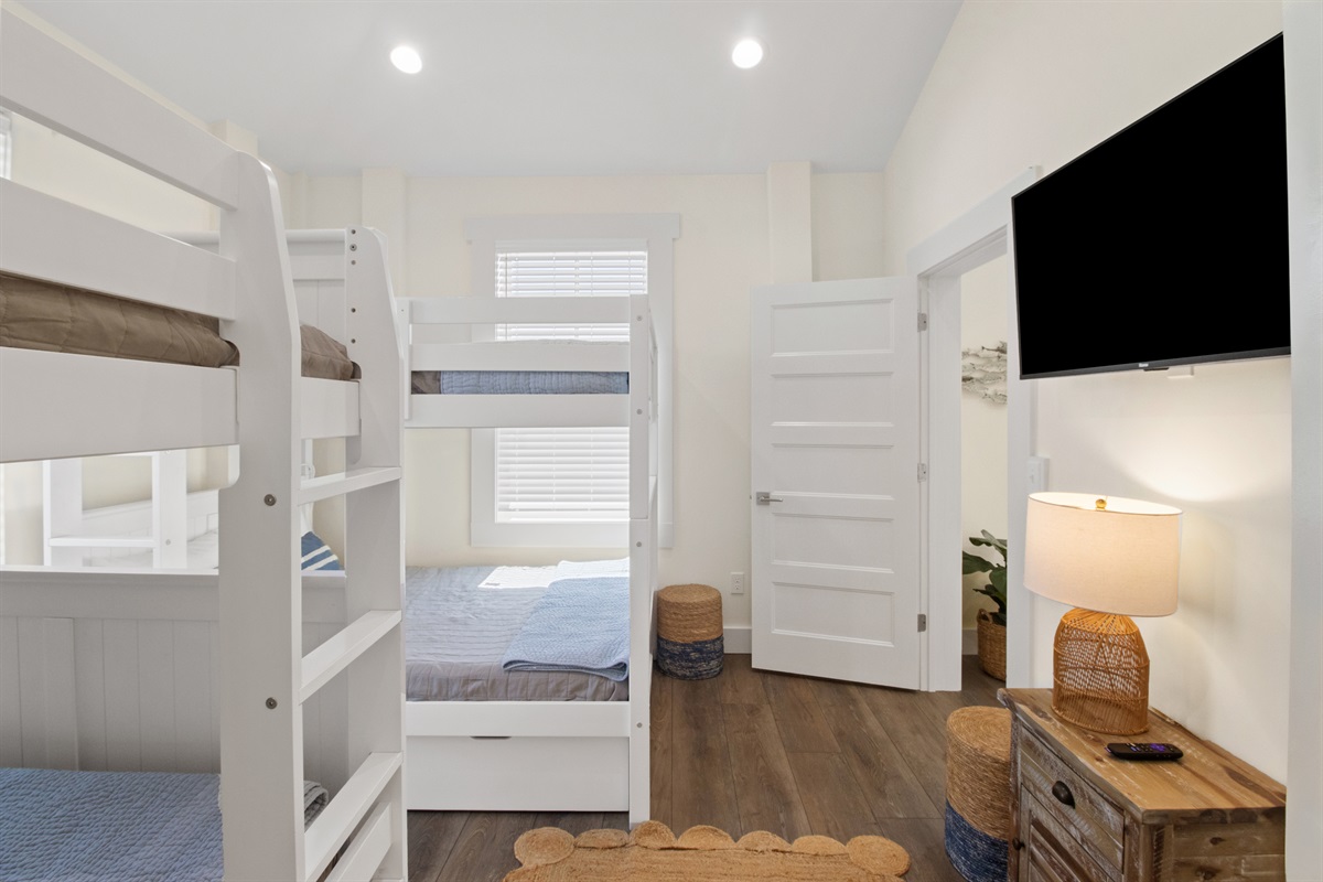 Two sets of full over full bunks with reading lights on each bunk