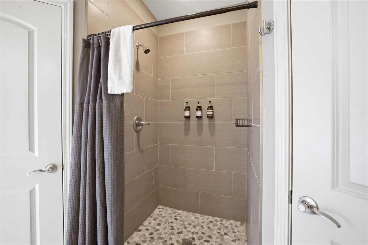 The walk-in shower in Unit 1 is built for a full reset—clean lines, plenty of space, and a simple setup that makes stepping in after a long day feel easy and comfortable.
