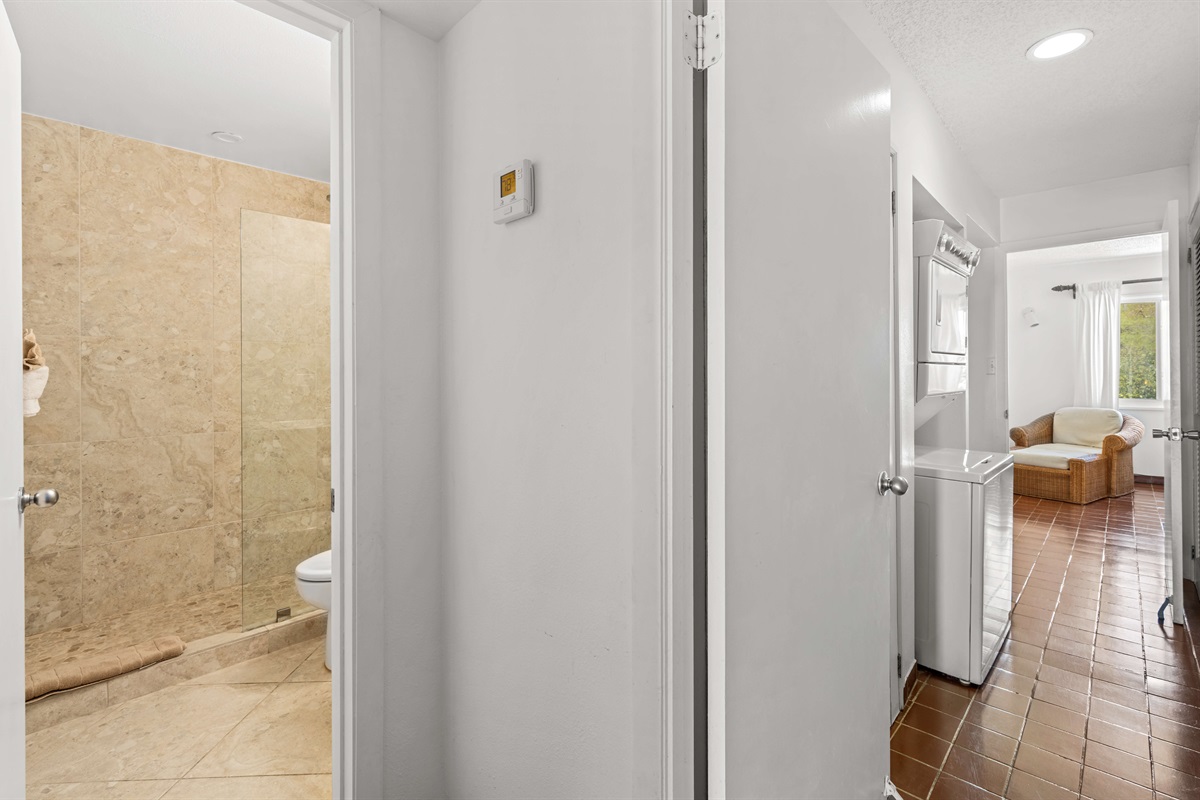 The first full bathroom is on the left of the hallway just off the kitchen.
