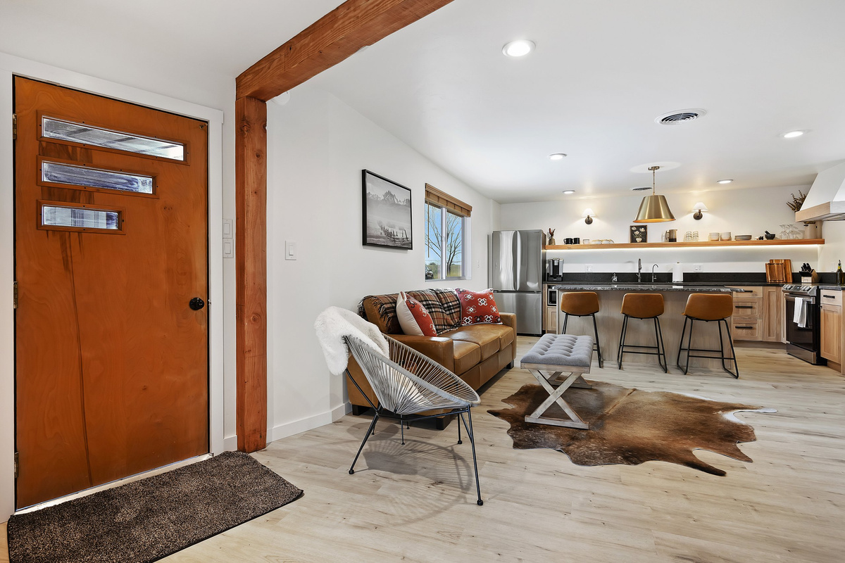 Warm wood entryway opening into the living space