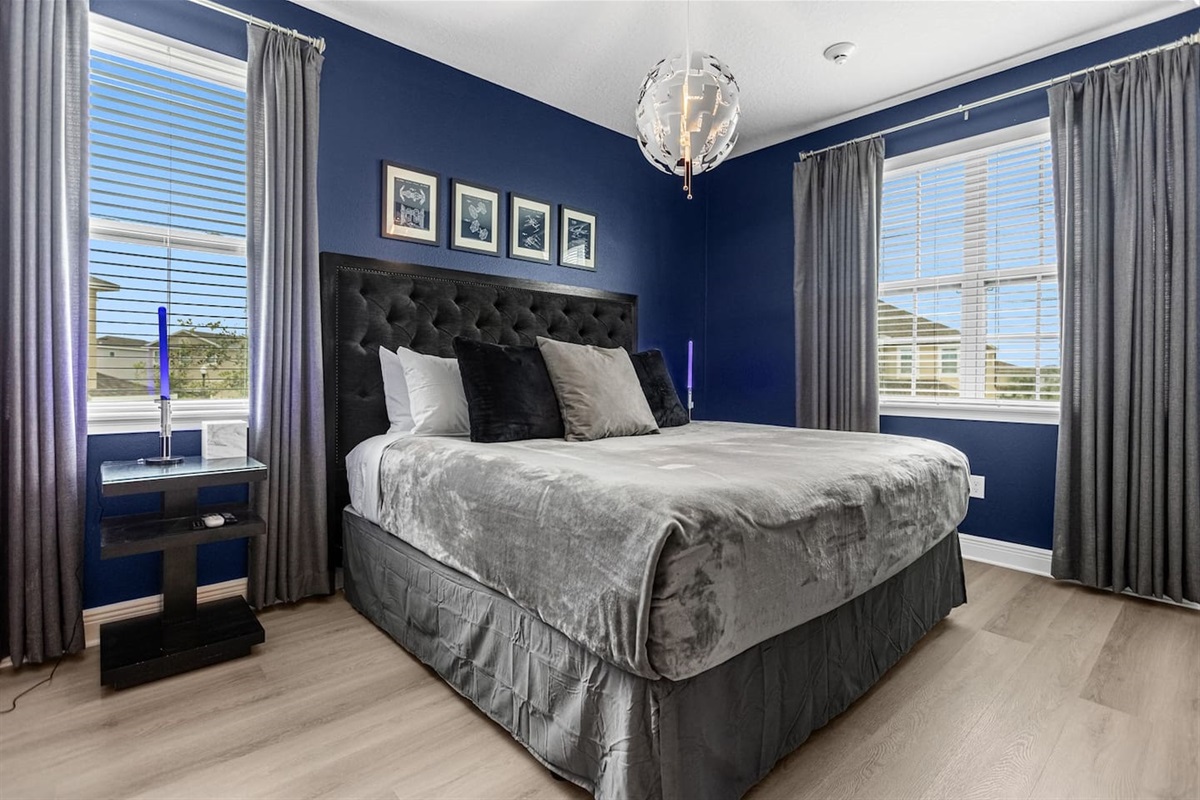 Star Wars-themed bedroom featuring a cozy king-size bed, immersive decor, and themed accents that transport guests to a galaxy far, far away for a memorable stay.