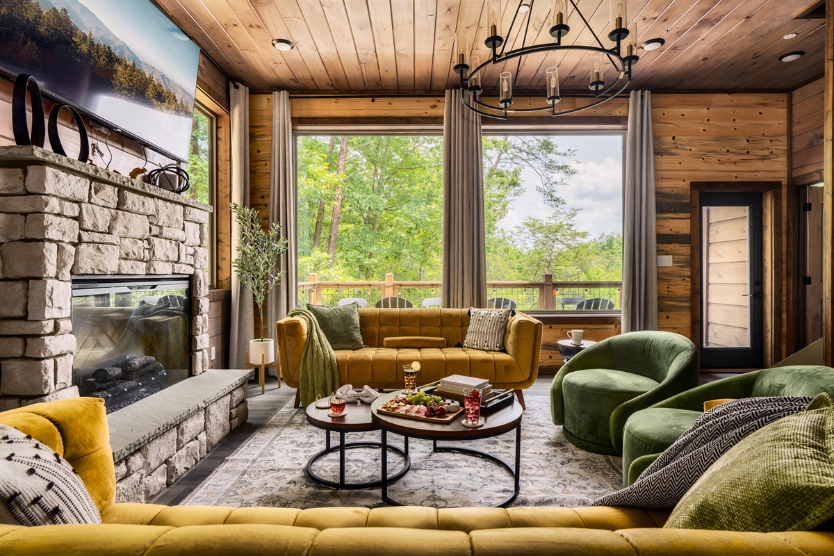 Stylish living room with plush seating & electric fireplace, perfect for family time