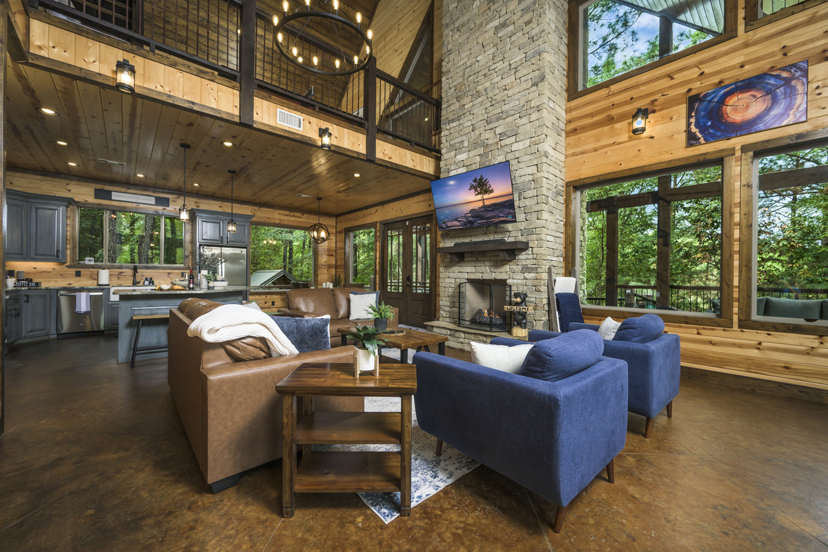When the log cabin charm meets modern comfort! Can you picture yourself curling up by that fireplace?