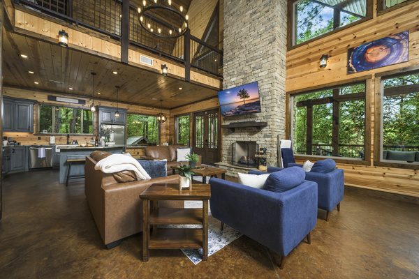 When the log cabin charm meets modern comfort! Can you picture yourself curling up by that fireplace?