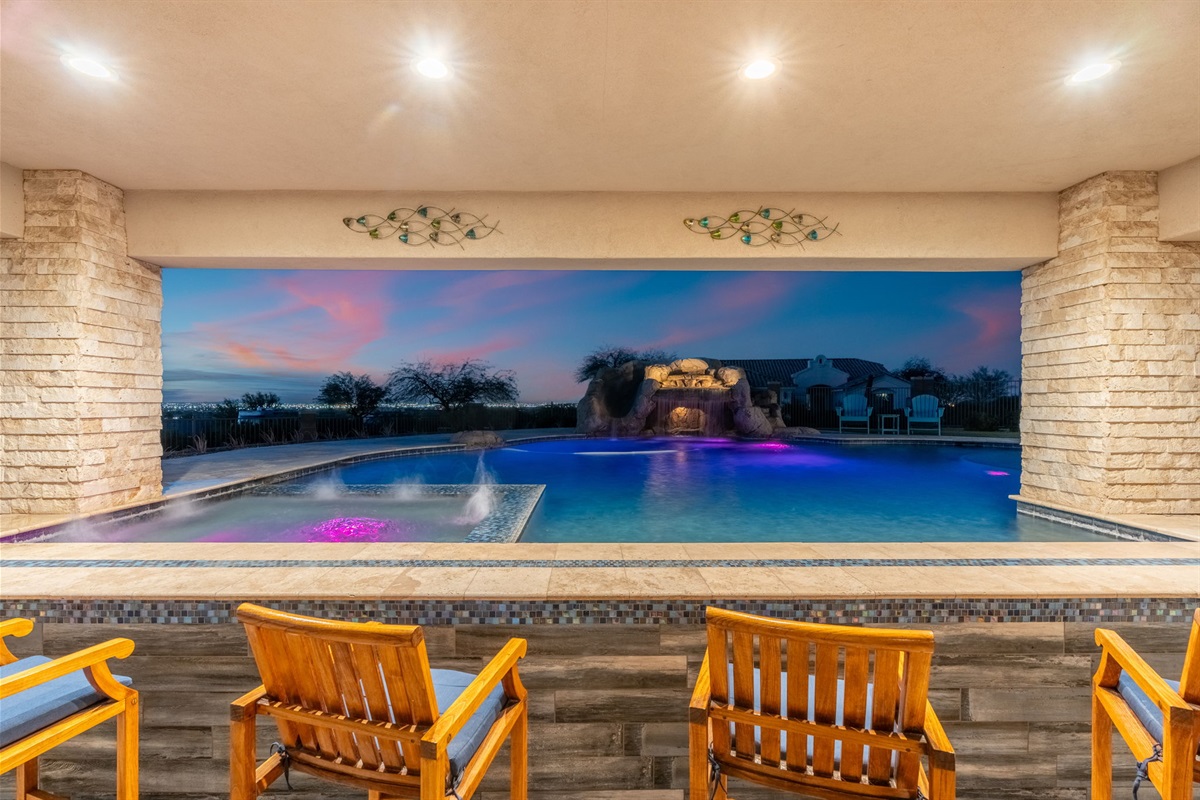 Evening poolside glow creates a stunning resort atmosphere perfect for night swims and unforgettable desert sunsets