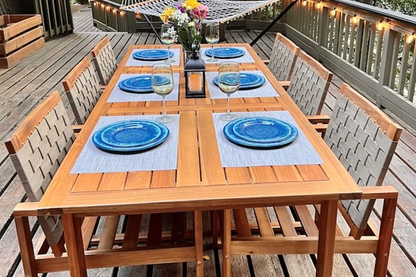 Dining and lounging area on deck overlooking the river